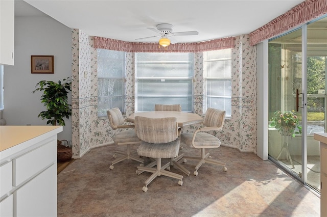 carpeted dining space featuring ceiling fan