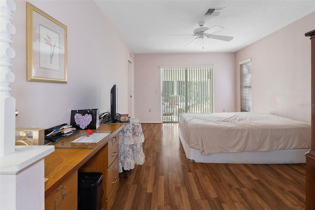 bedroom featuring a textured ceiling, dark hardwood / wood-style floors, access to outside, and ceiling fan