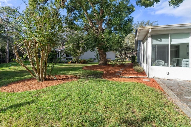 view of yard with a sunroom