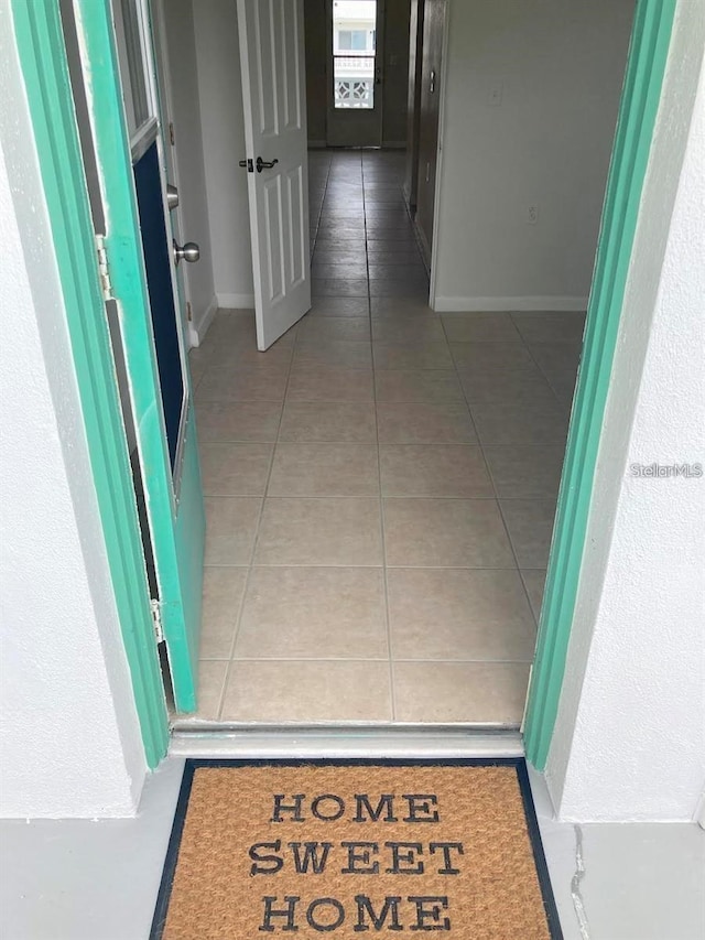 hallway featuring tile patterned flooring