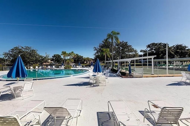 view of swimming pool featuring a patio area