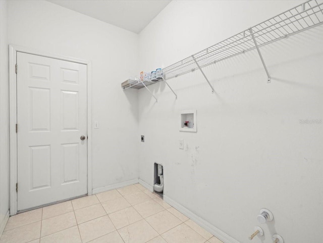4264 Braemere Dr, Spring Hill, FL 34609 - laundry room featuring gas dryer hookup, washer hookup, baseboards, electric dryer hookup, and light tile patterned flooring