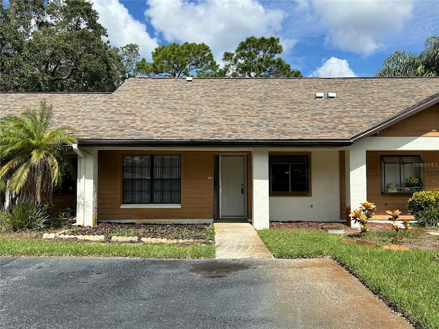 single story home featuring covered porch