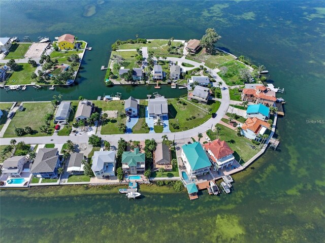 drone / aerial view featuring a water view and a residential view