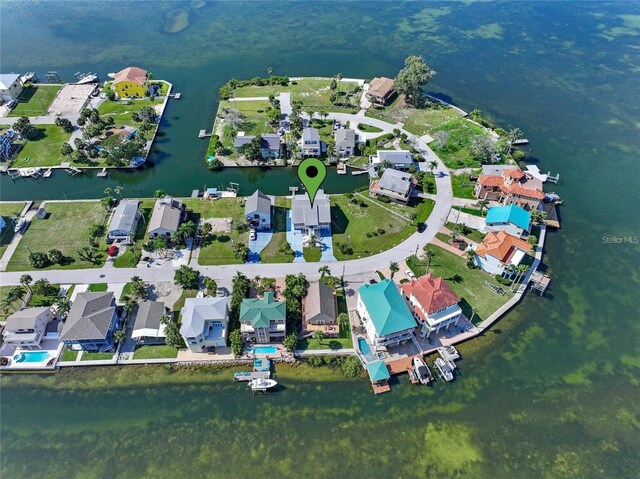 drone / aerial view with a residential view and a water view
