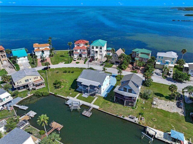 birds eye view of property with a water view and a residential view