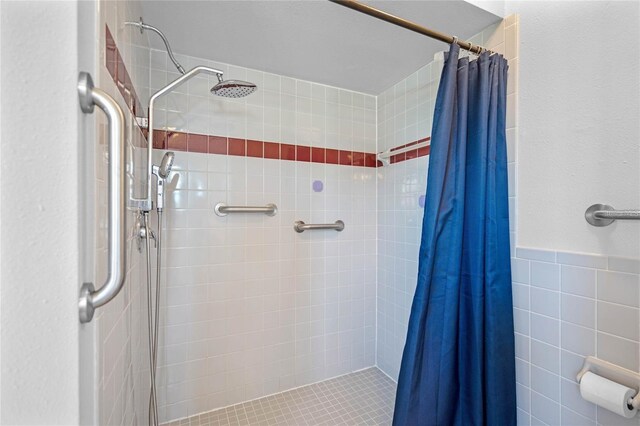 full bath featuring a stall shower