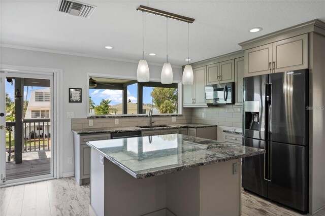 kitchen featuring gray cabinets, visible vents, a sink, and black appliances