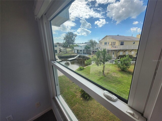 balcony with a water view and a residential view