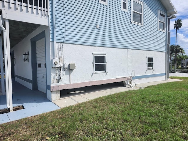 view of property exterior featuring a lawn