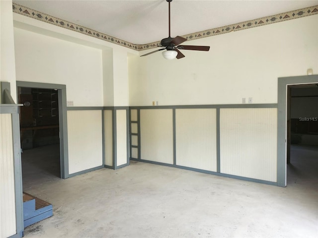 unfurnished room with ceiling fan