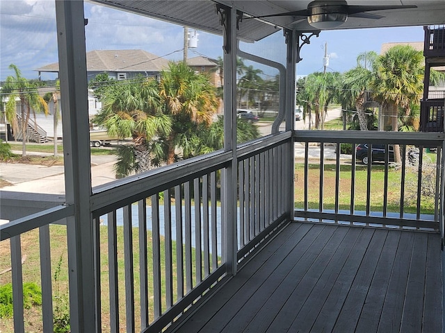 wooden deck featuring ceiling fan