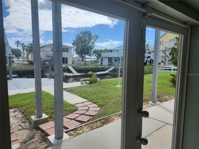 entryway featuring a water view and a residential view