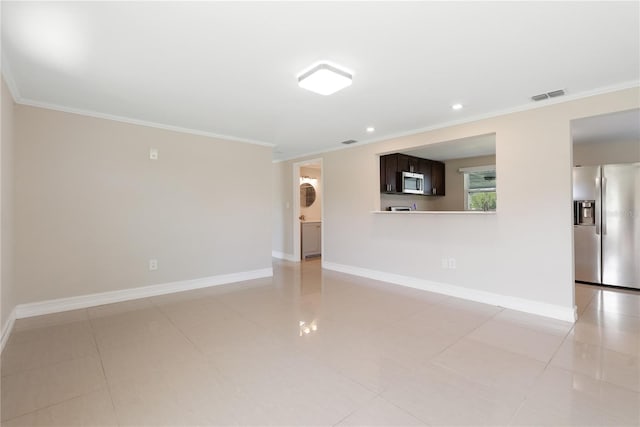 unfurnished living room with crown molding and light tile patterned flooring