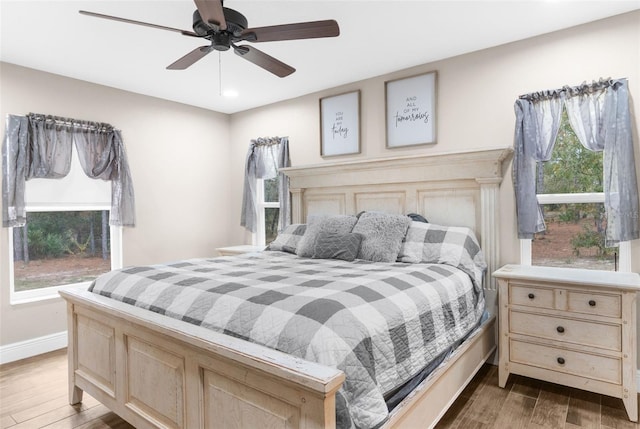 bedroom featuring hardwood / wood-style flooring and ceiling fan