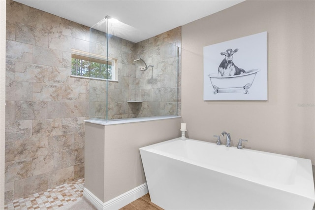 bathroom with separate shower and tub and hardwood / wood-style flooring