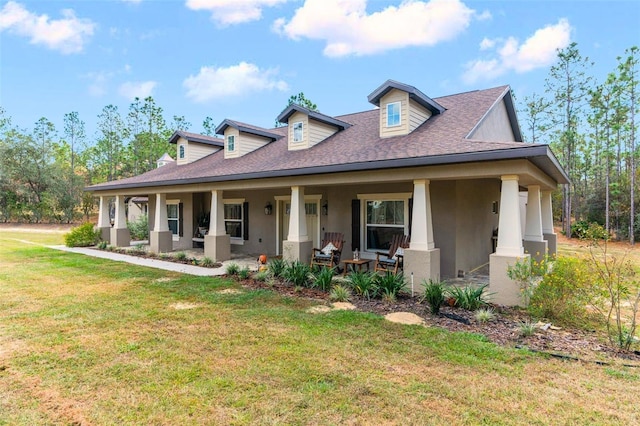 view of front facade featuring a porch and a front yard