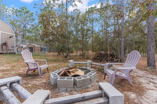 view of patio / terrace with an outdoor fire pit