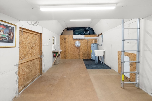 basement featuring sink and electric water heater