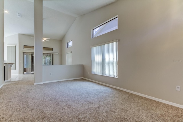 unfurnished room with ceiling fan, light carpet, and high vaulted ceiling