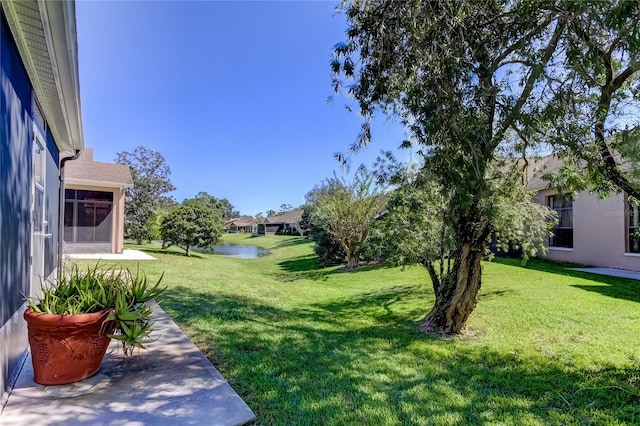 view of yard with a water view