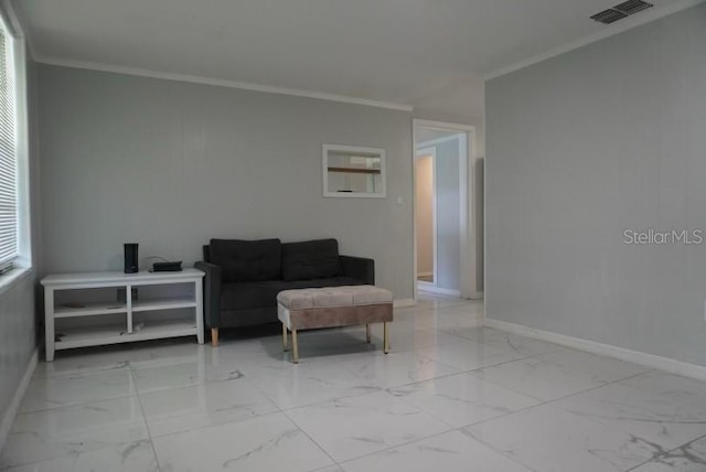 sitting room featuring crown molding