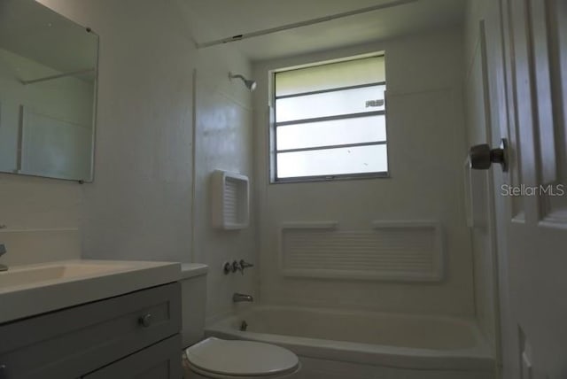 full bathroom featuring  shower combination, vanity, and toilet