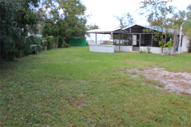 view of yard with a sunroom