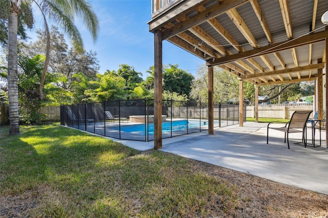 view of pool featuring a patio and a lawn