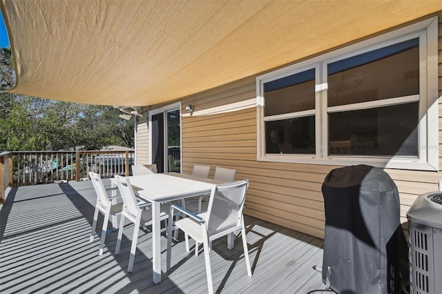 wooden terrace with area for grilling