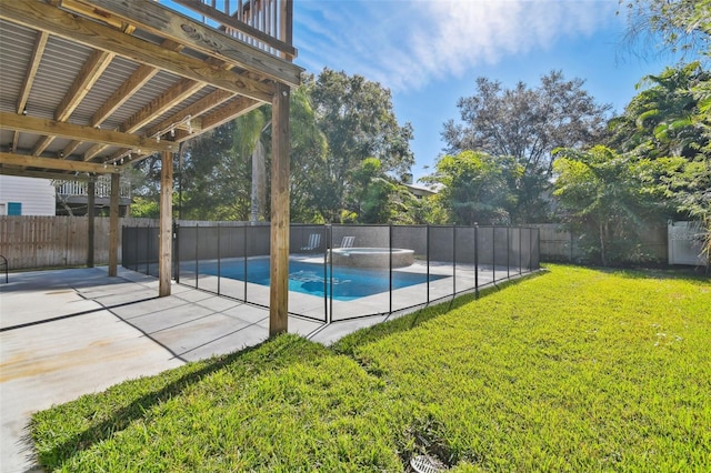 view of pool with a yard and a patio