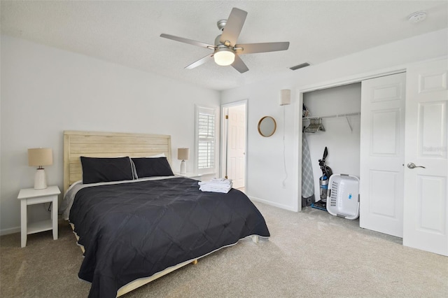 bedroom with carpet floors, a closet, and ceiling fan