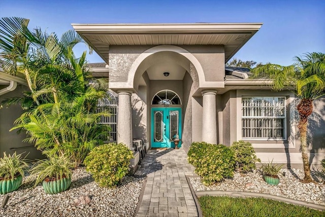 view of exterior entry featuring french doors