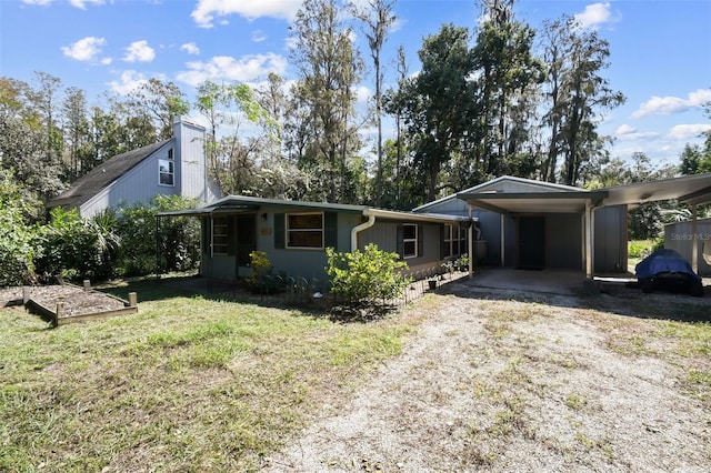 single story home with a carport and a front yard