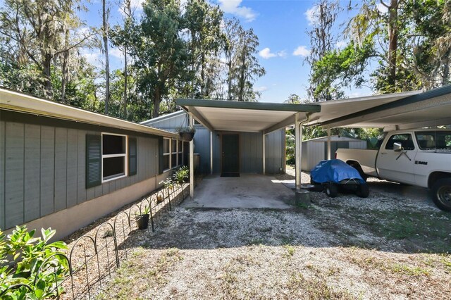 view of vehicle parking featuring a carport