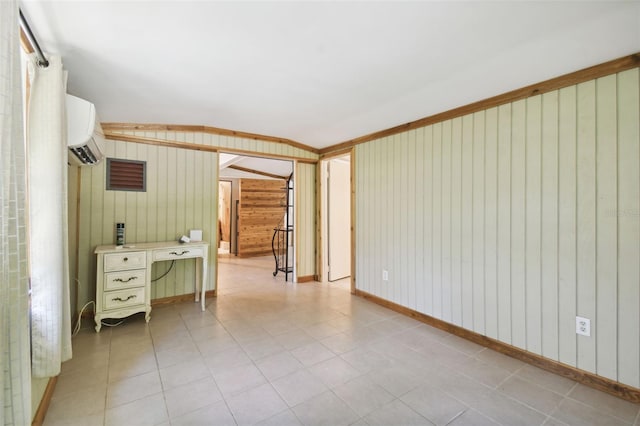 empty room featuring wooden walls and a wall mounted air conditioner