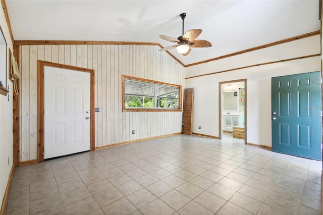 entryway with lofted ceiling, ceiling fan, and light tile patterned flooring