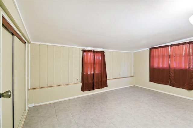 unfurnished room with ornamental molding