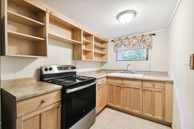 kitchen featuring light brown cabinets, sink, light tile patterned flooring, and electric range