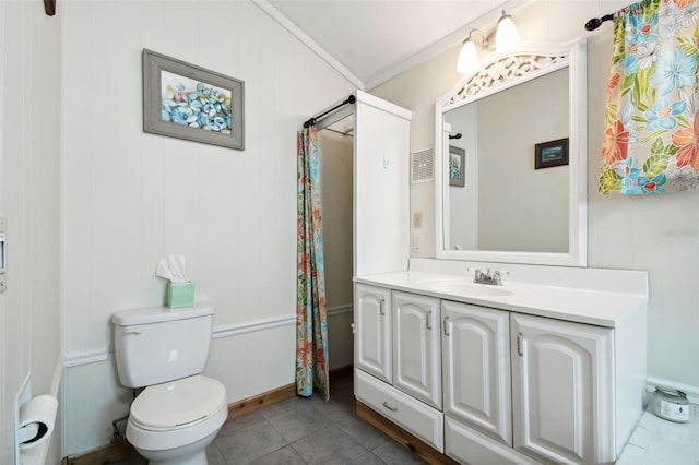 bathroom with ornamental molding, toilet, vanity, and tile patterned floors