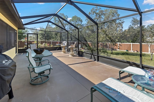 view of patio / terrace featuring glass enclosure