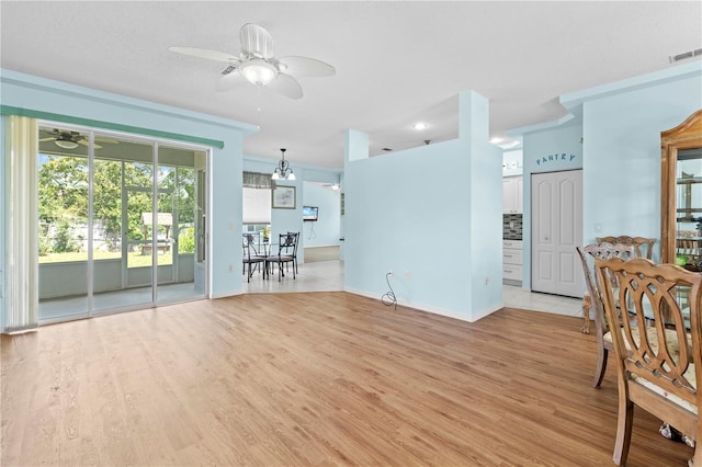 interior space featuring ceiling fan and light wood-type flooring