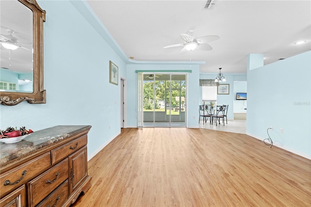 living room featuring light hardwood / wood-style floors and ceiling fan