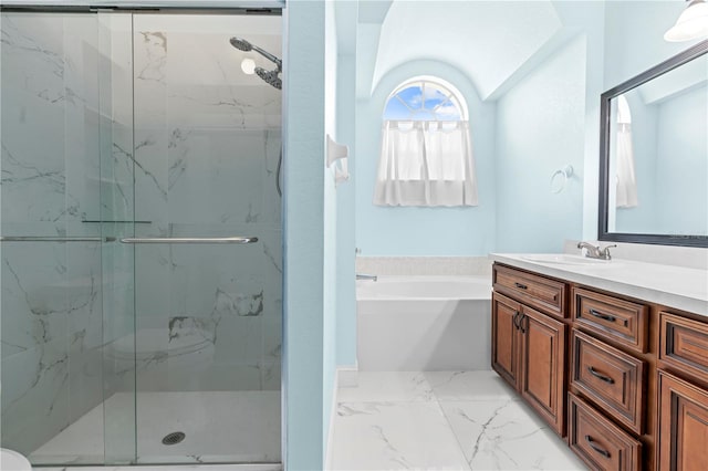 bathroom featuring vanity and separate shower and tub