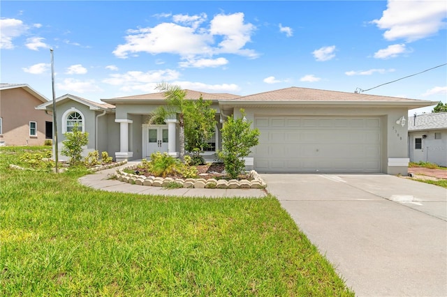 single story home featuring a front lawn and a garage