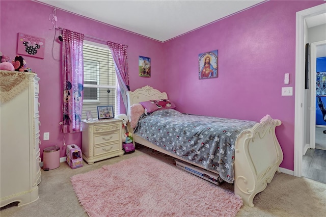 bedroom featuring light colored carpet