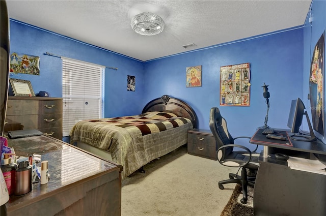 bedroom featuring carpet floors and a textured ceiling