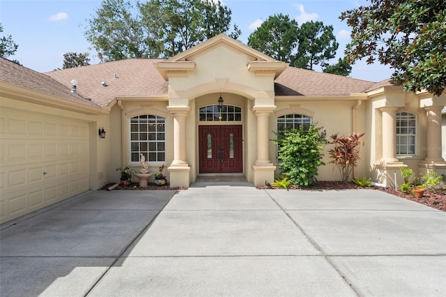 view of exterior entry featuring a garage