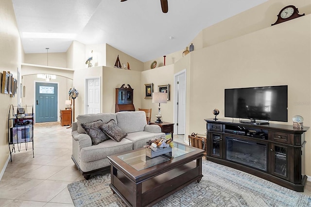 living room featuring light tile patterned flooring, high vaulted ceiling, and ceiling fan