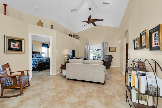 living room featuring ceiling fan and high vaulted ceiling